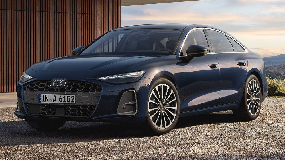 Audi A6 Limousine in dunklem Blau steht vor moderner Architektur und zeigt elegante Linien und klare Proportionen