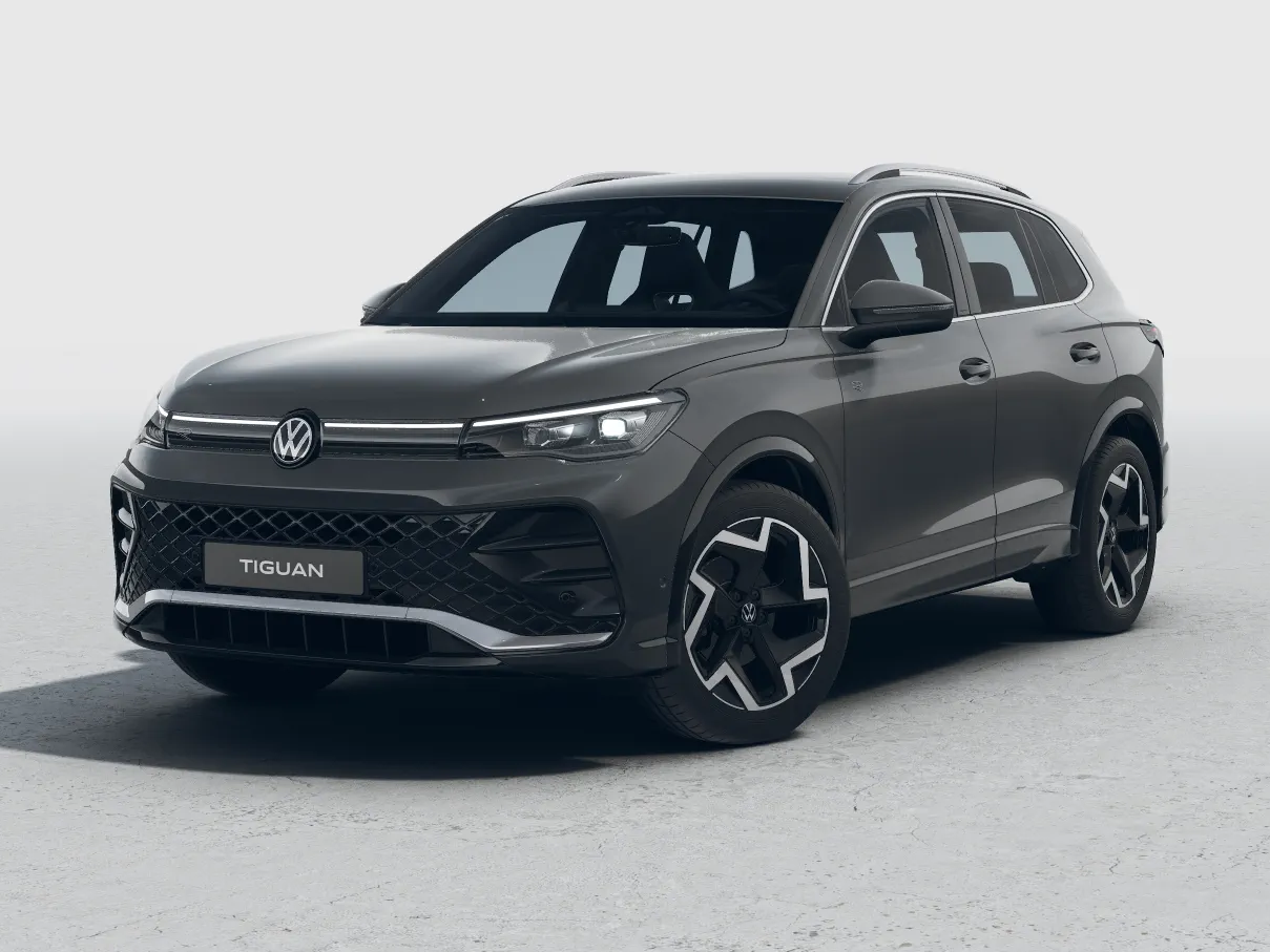 Grauer Volkswagen Tiguan R-Line, Frontansicht im Studio mit schwarzen Felgen.